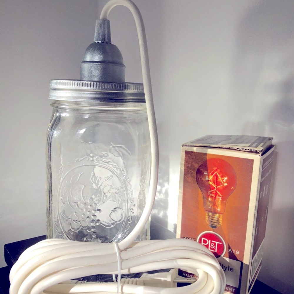Homemade mason jar pendant light with fabric cord and Edison bulb included.